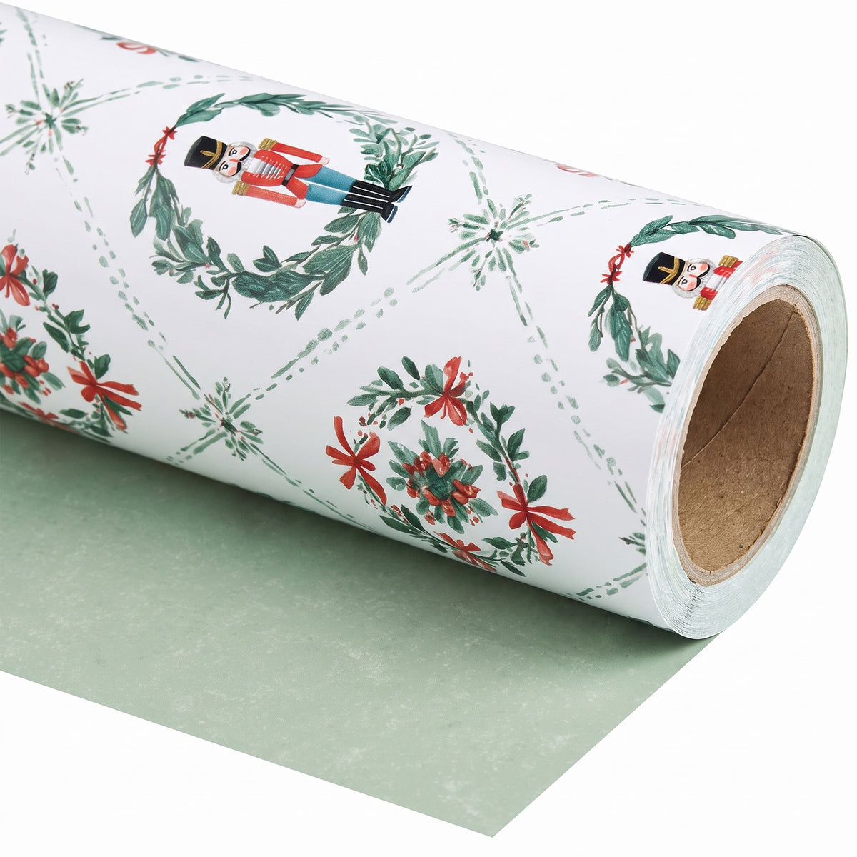 Nutcracker Wreaths wrapping paper roll, unrolled to show the solid sage green back