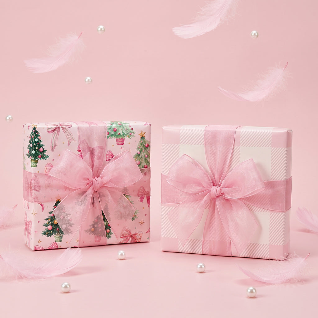 Two gifts wrapped in Pink Trees & Bows paper, one showing the pink gingham back, with sheer pink bows